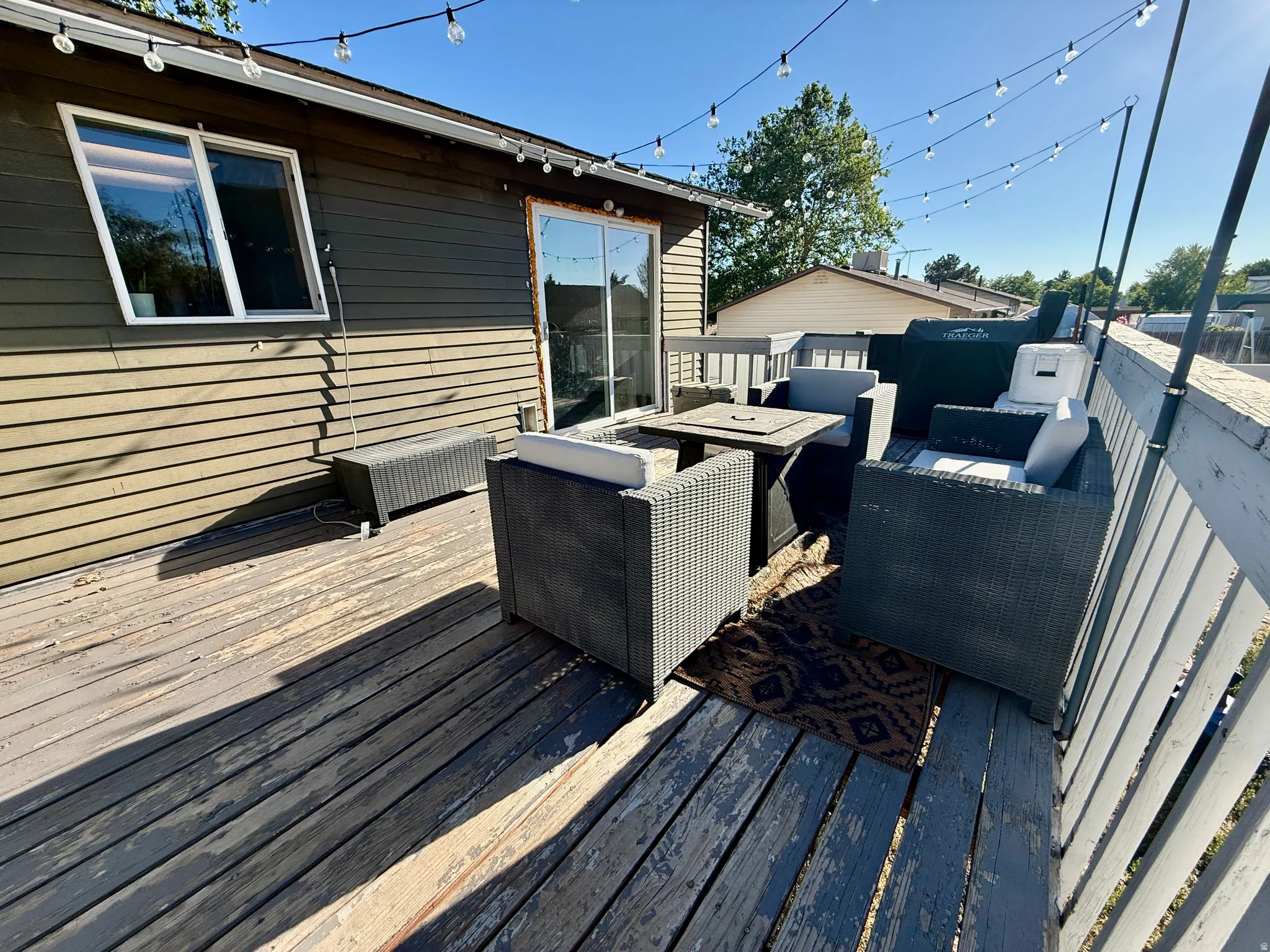 Expansive outdoor deck featuring wood flooring and a perimeter railing