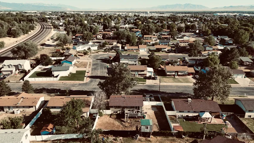 Aerial perspective showcasing a residential neighborhood with varied single-story and two-story homes