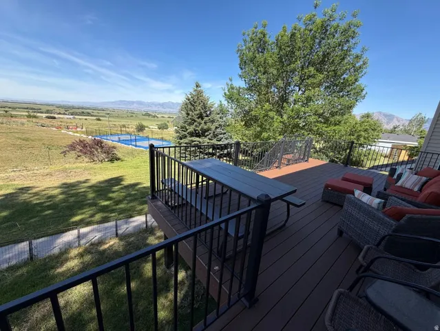 Expansive outdoor deck featuring composite decking and a black metal railing system