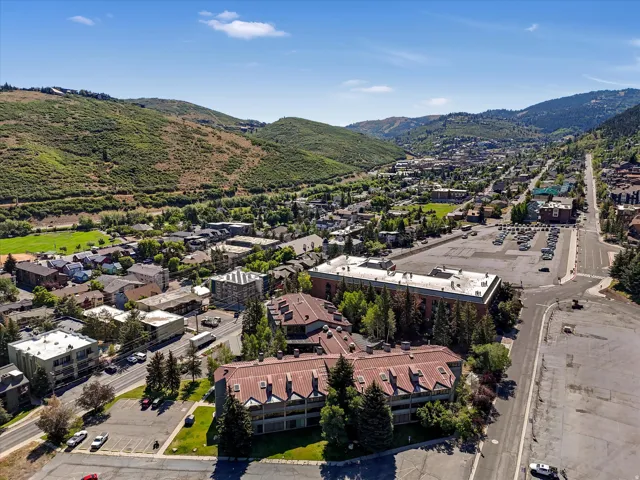 Aerial perspective showcasing a vibrant community nestled within a mountainous landscape