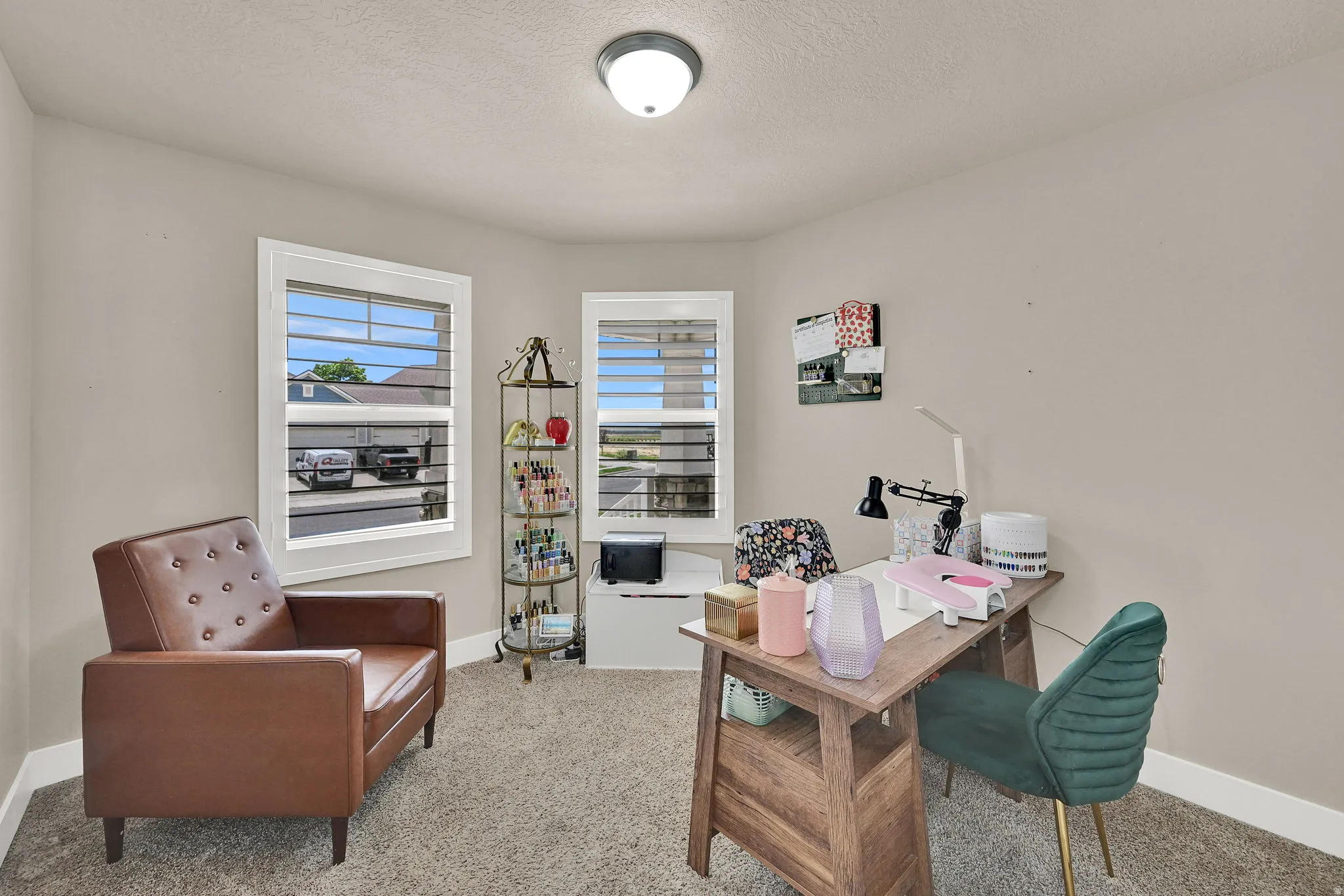Neutral-toned room featuring a light beige wall color and textured carpet flooring