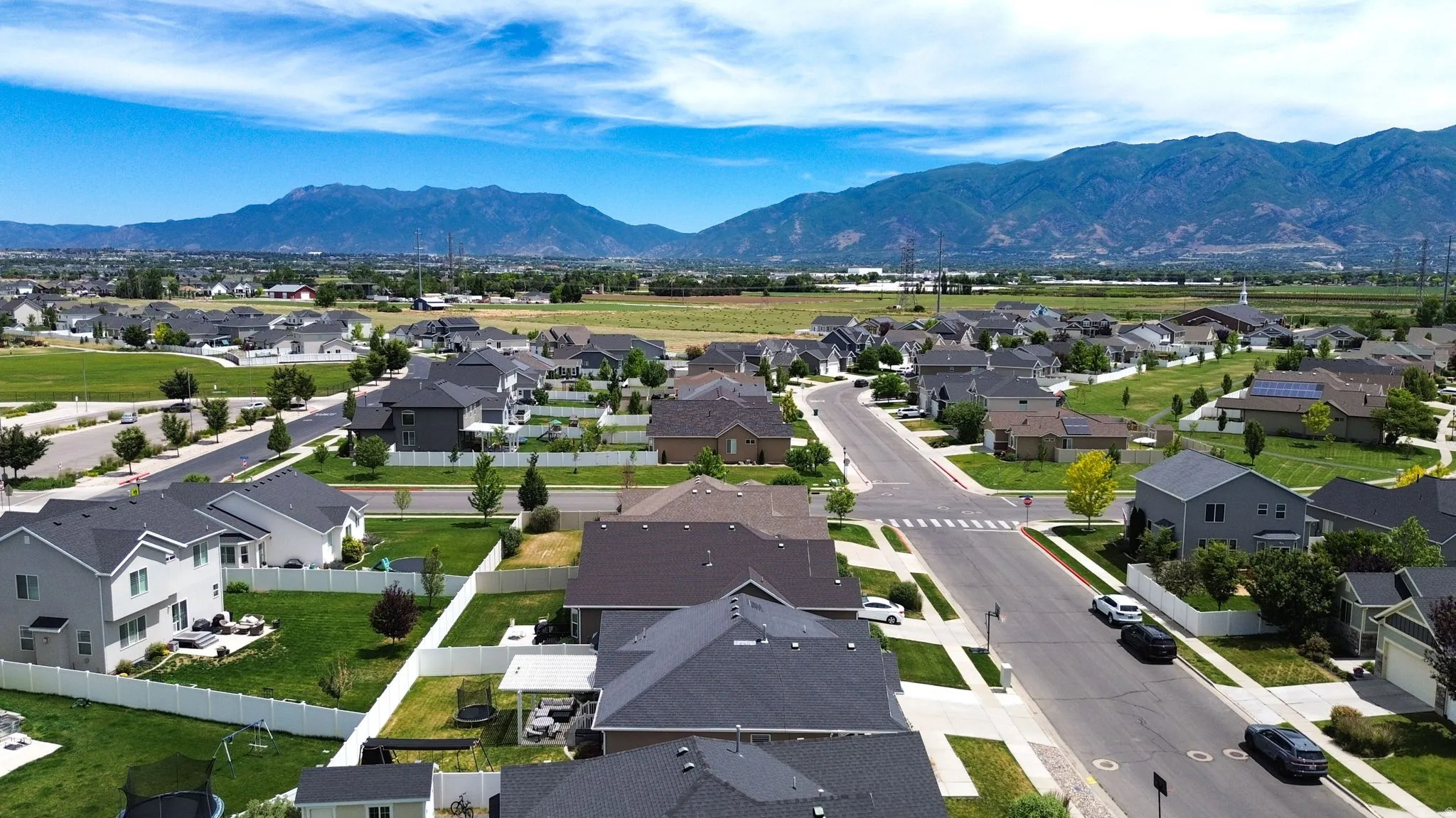 Expansive suburban neighborhood featuring a grid of residential streets and varied home designs
