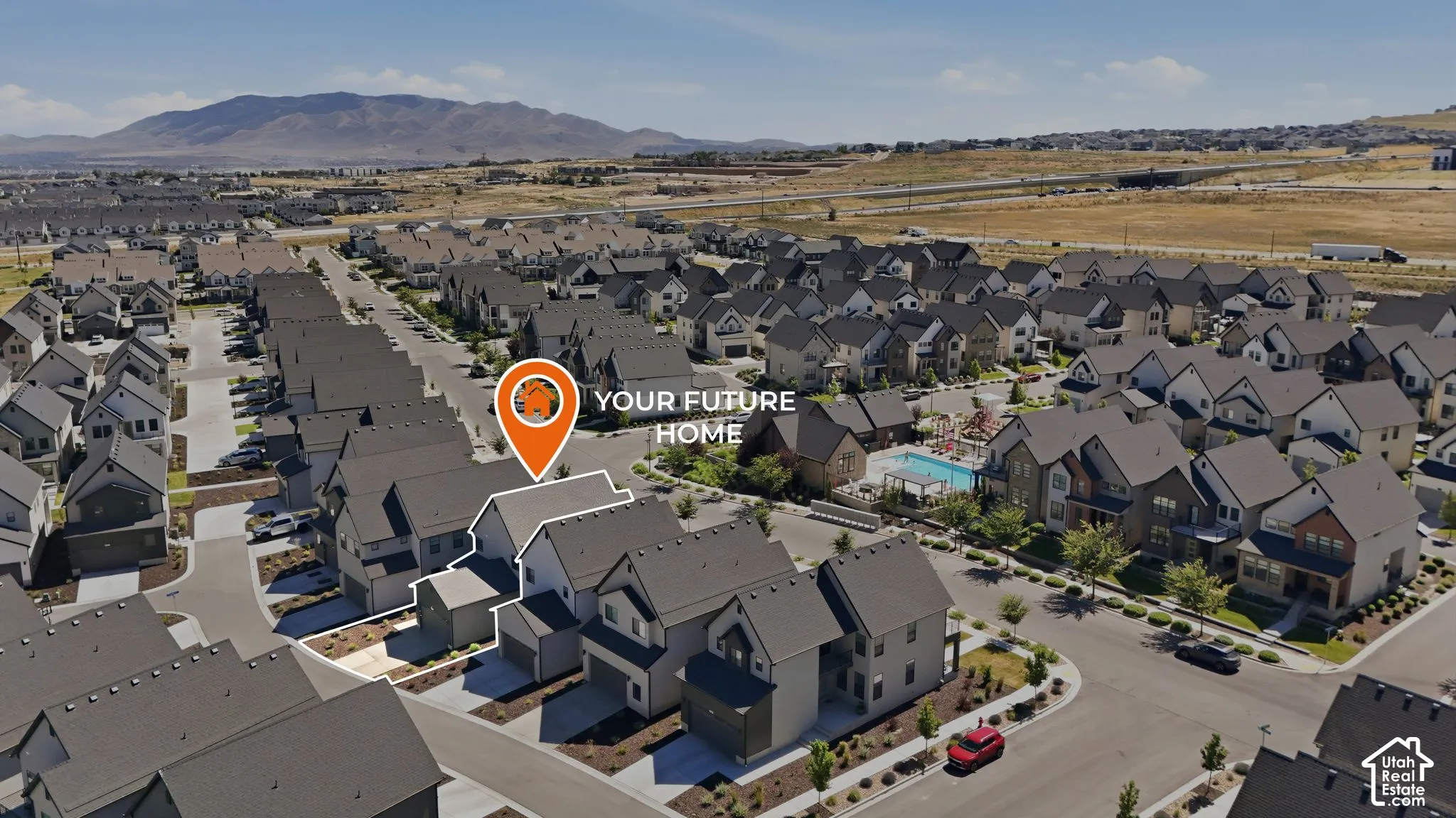 Residential development featuring a community pool and mountain backdrop