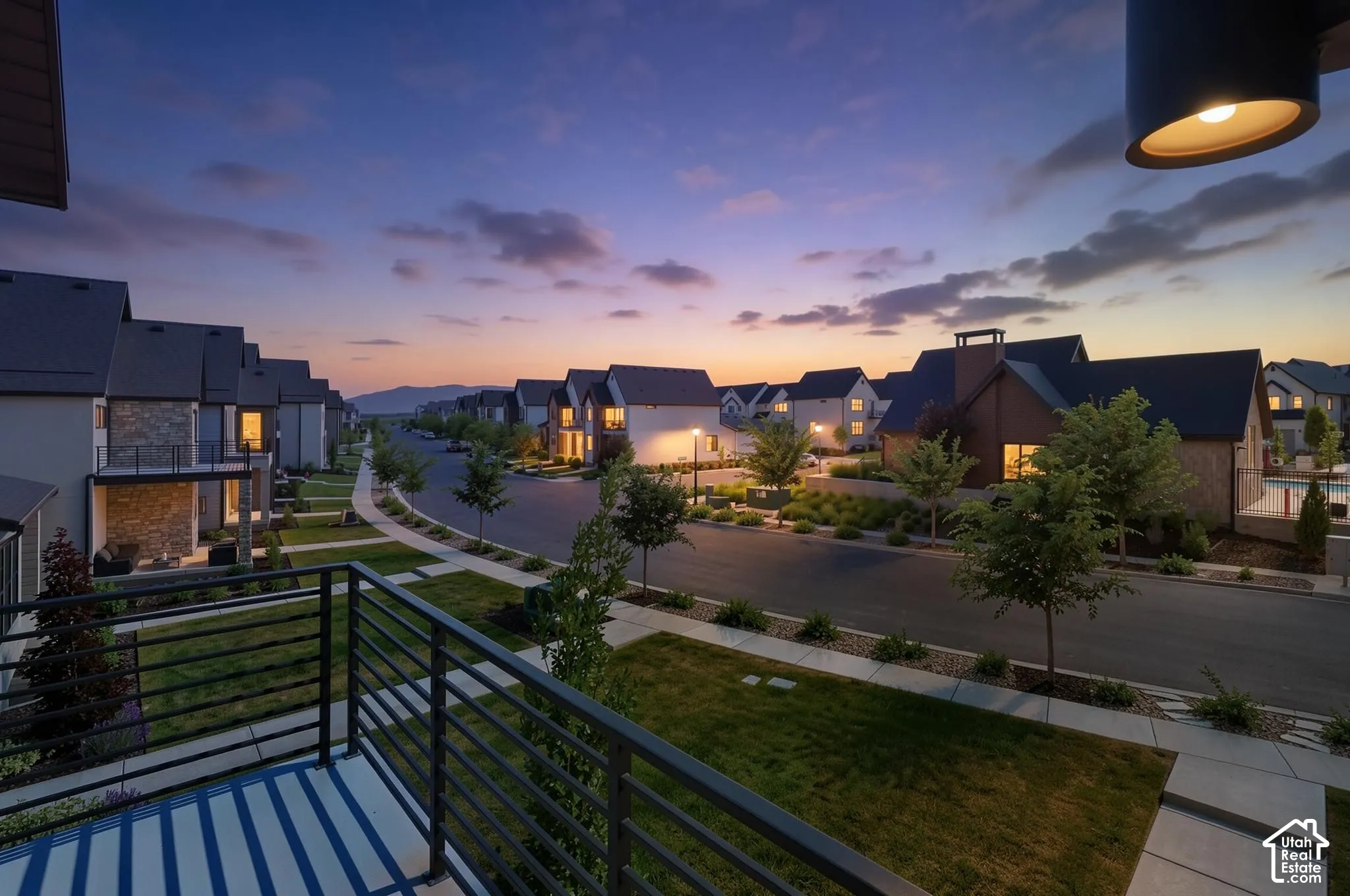 Balcony with metal railings overlooking a residential street