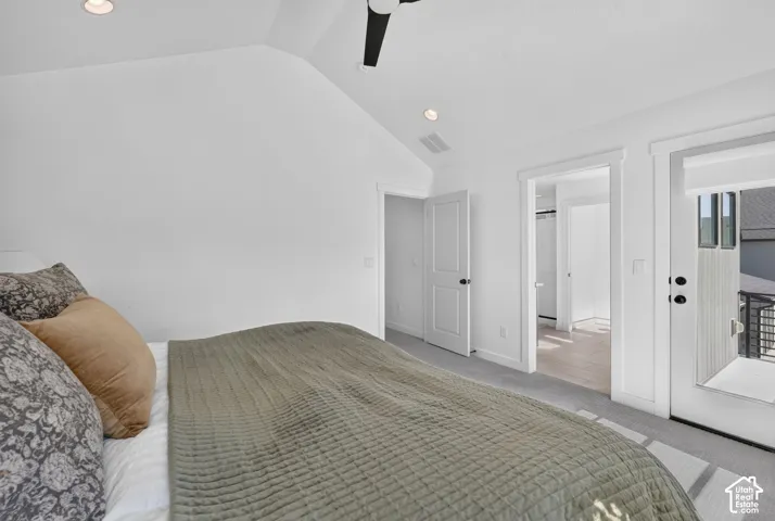 Bedroom featuring a vaulted ceiling with recessed lighting, a modern ceiling fan, and light gray carpet flooring