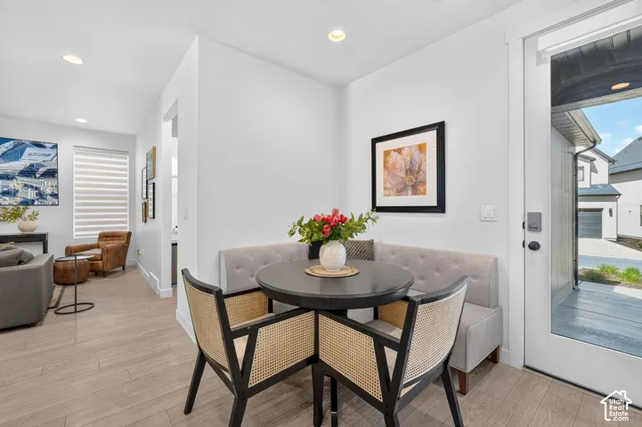 Dining nook featuring a built-in upholstered bench and a round table