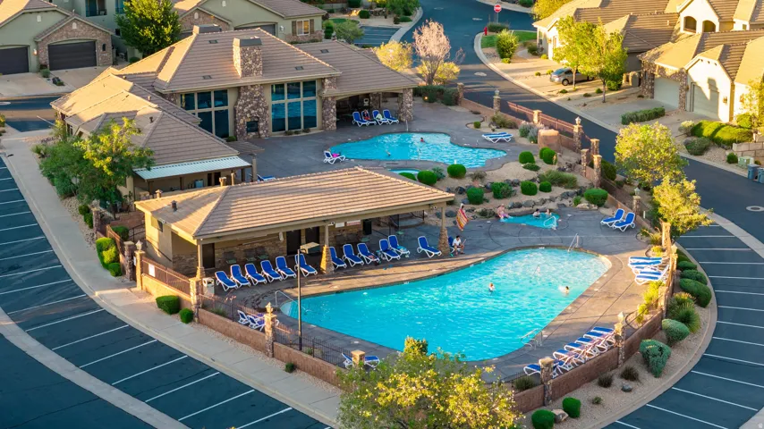 Community amenities featuring multiple swimming pools, a spa, and a clubhouse.