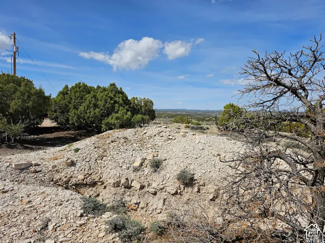 Expansive land parcel featuring natural terrain and distant horizon