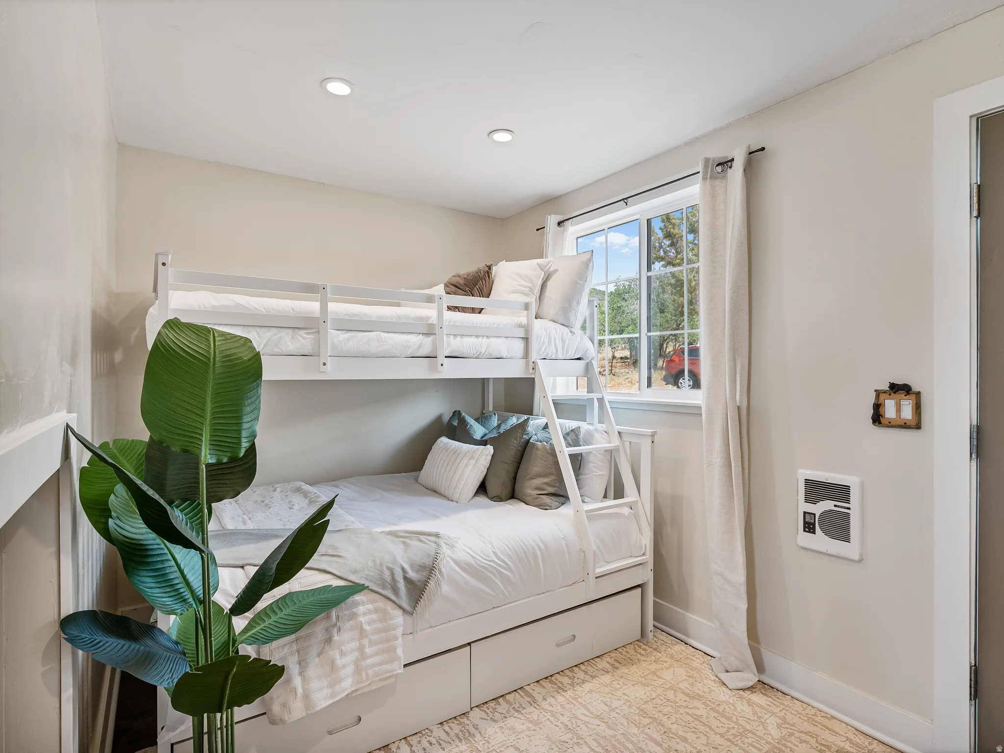Bunk bed featuring integrated storage drawers and a ladder.