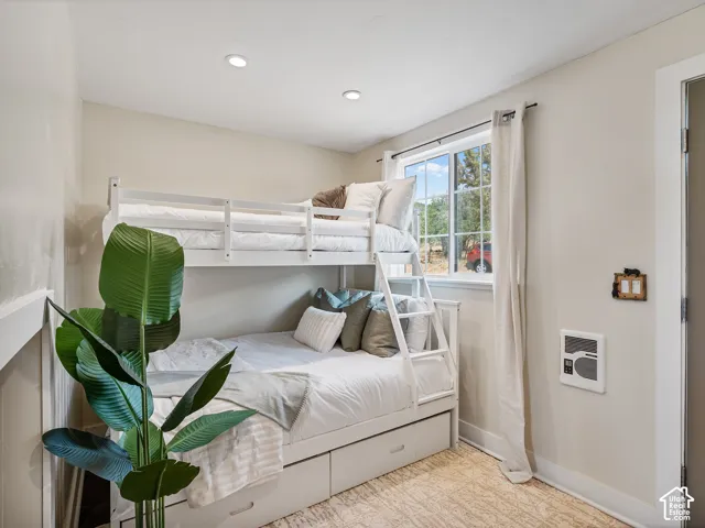 Bunk bed featuring integrated storage drawers and a ladder.