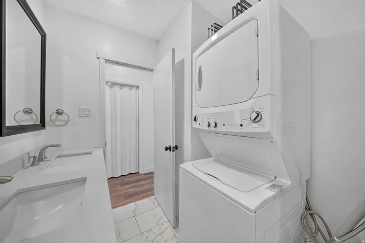 White stacked washer and dryer unit