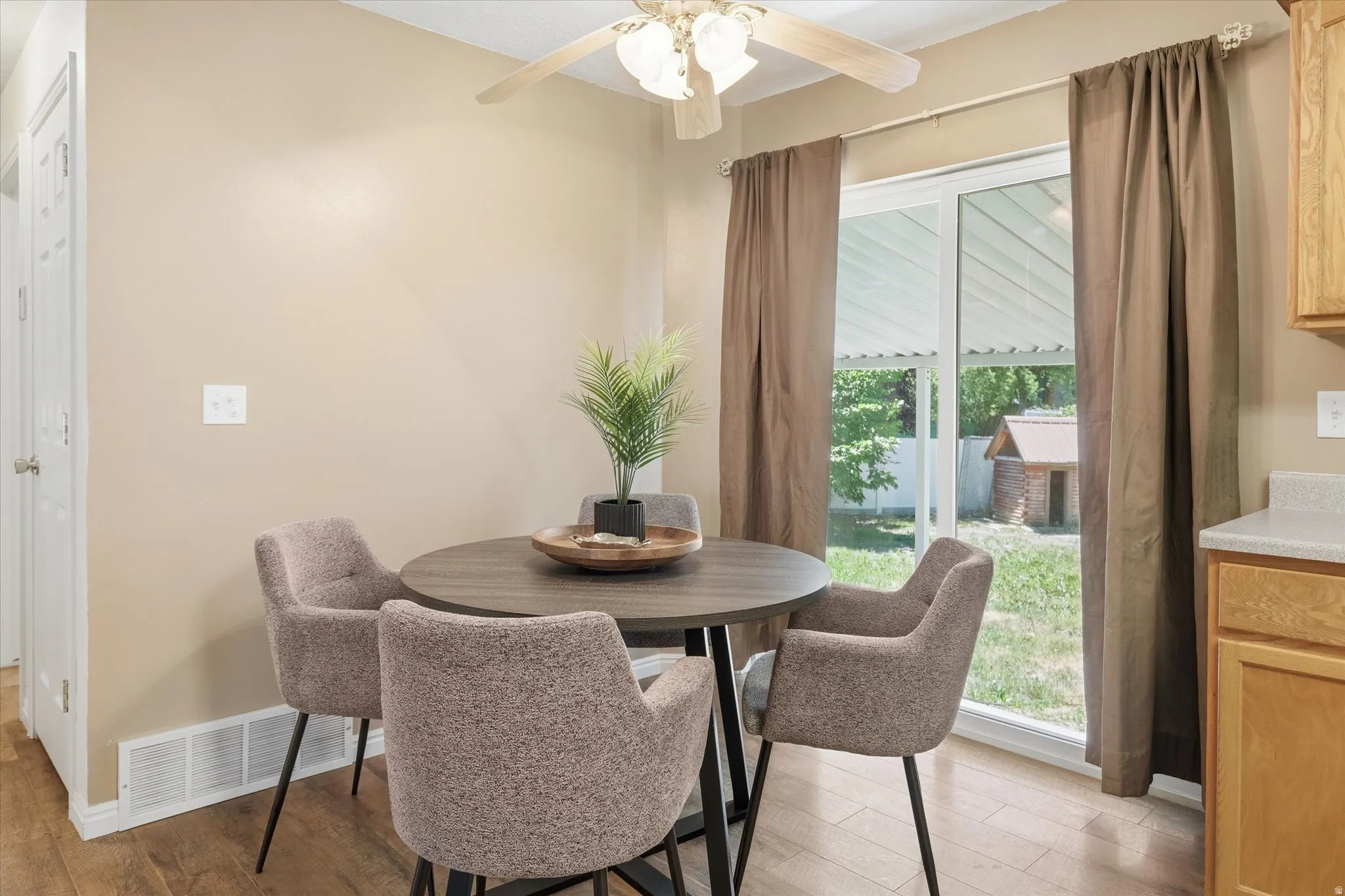 Dining area featuring wood-finish flooring and neutral wall tones