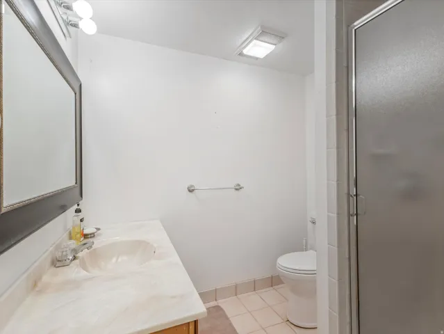 Bathroom featuring a vanity with an integrated sink and light-toned countertop