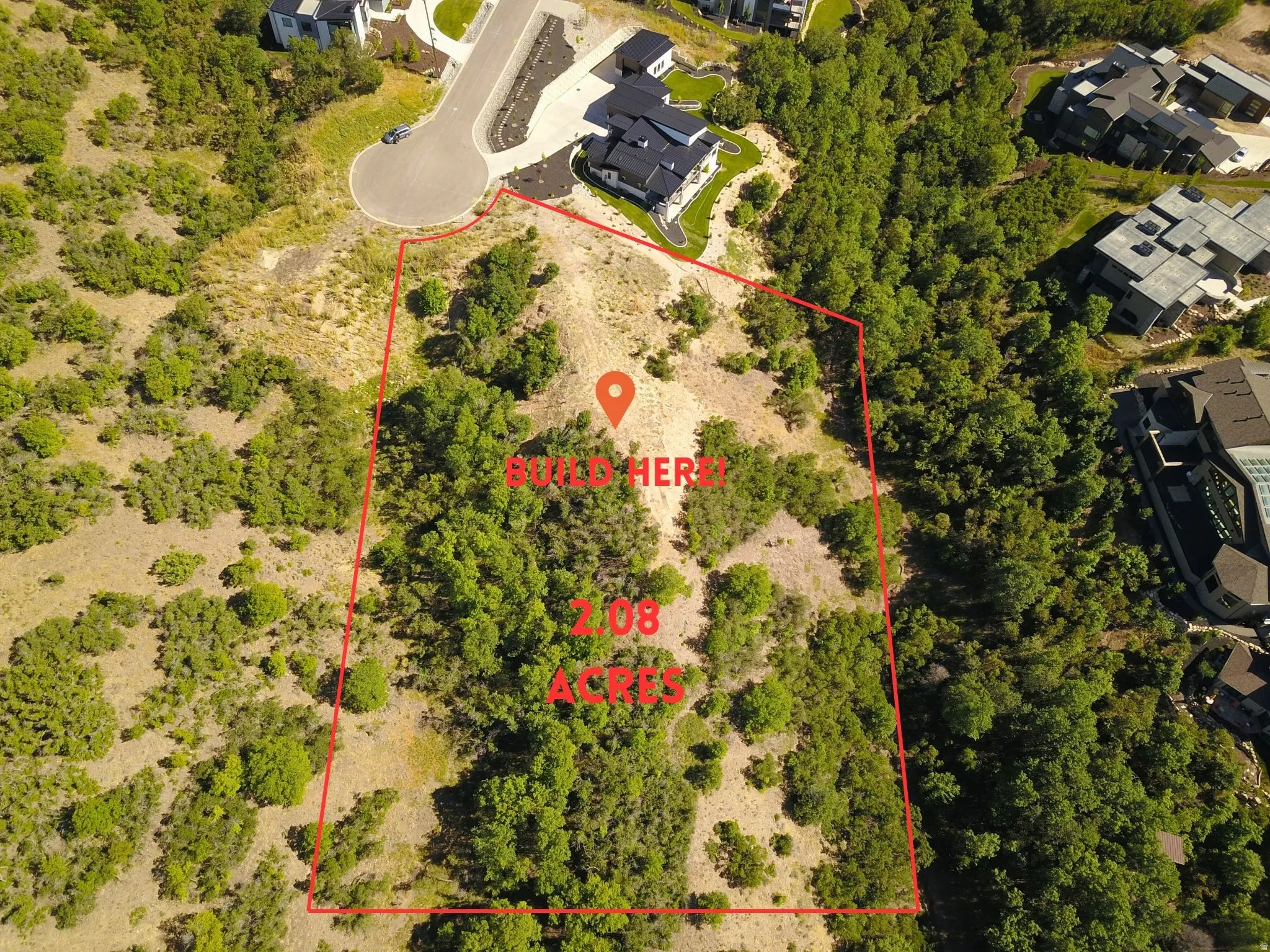 Expansive 2.08-acre parcel outlined in red, featuring varied topography and natural vegetation