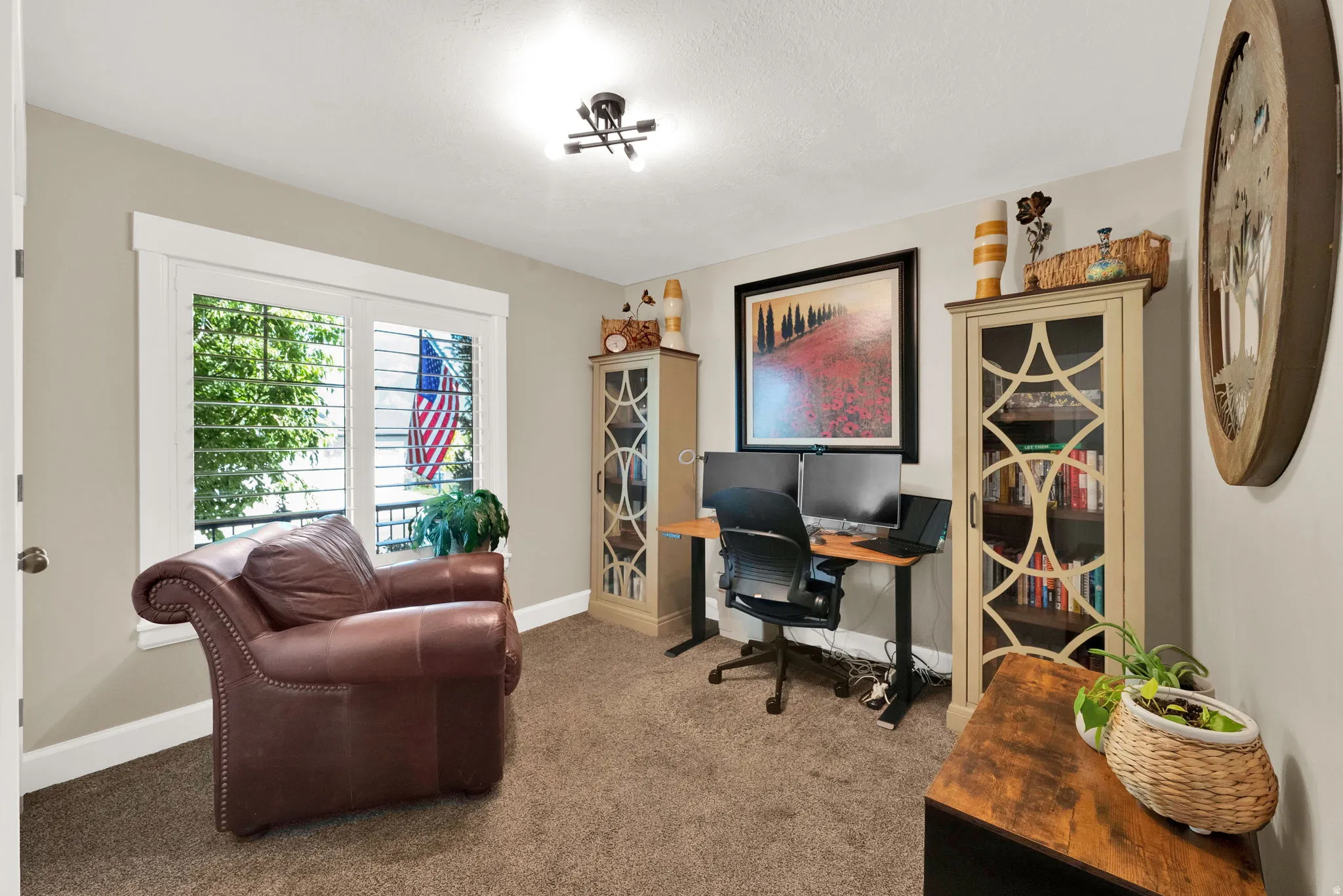 Dedicated room with neutral wall tones and a textured carpet