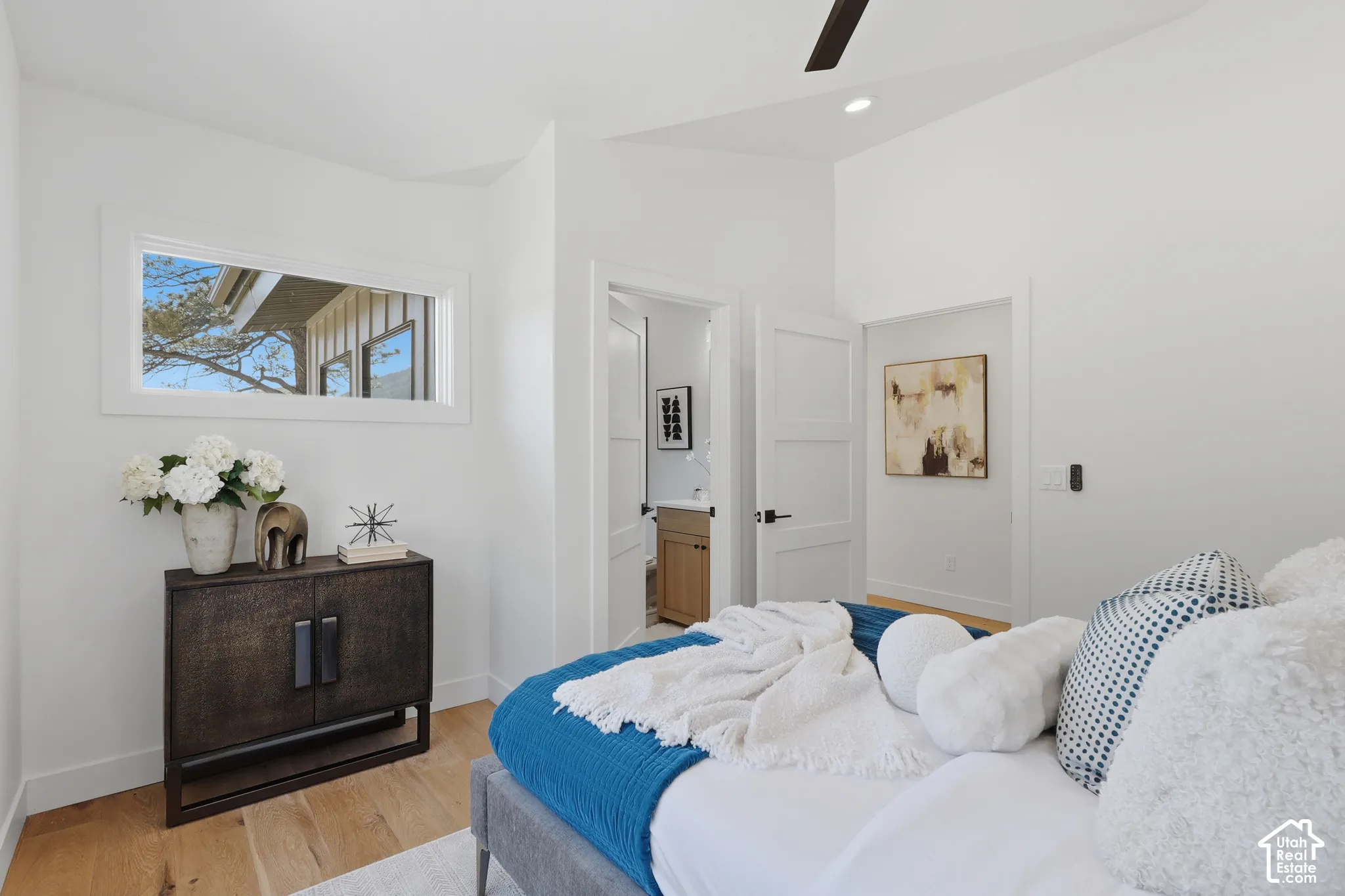 White walls with light wood-finish flooring