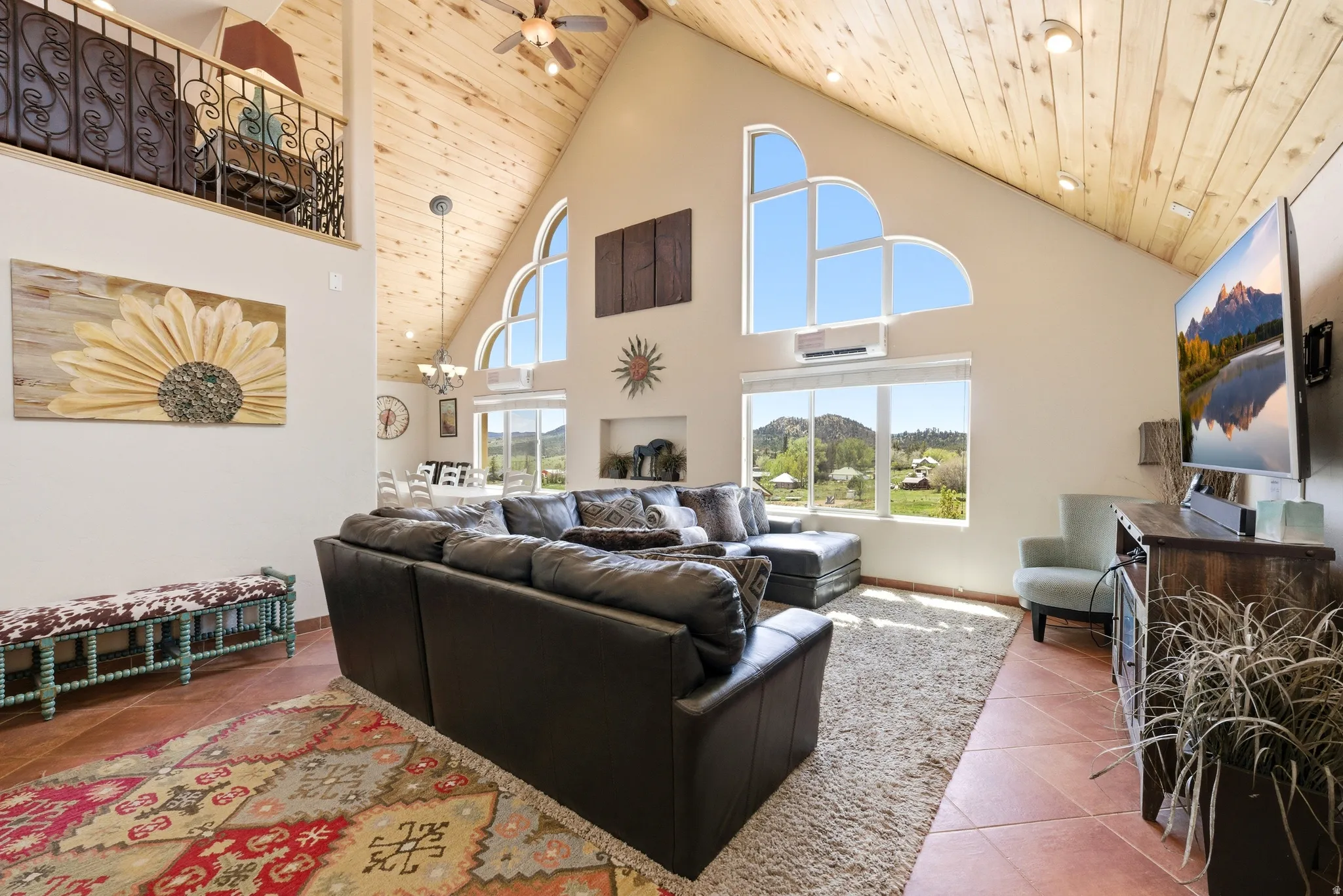 Vaulted wood-paneled ceiling with recessed lighting