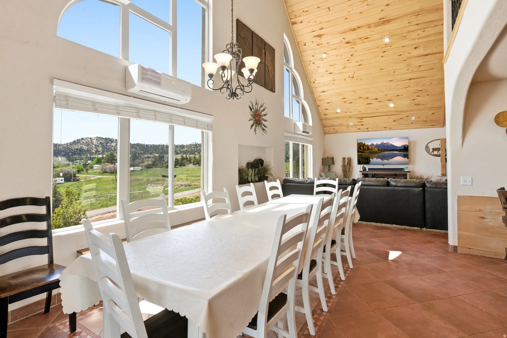 Vaulted wood-paneled ceiling with recessed lighting