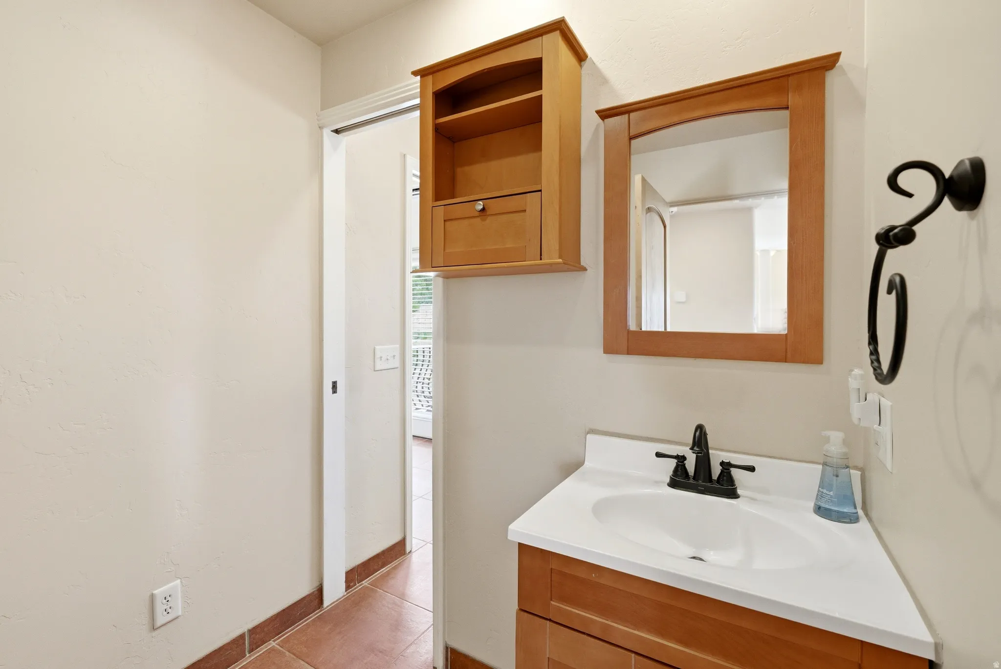 Bathroom vanity with a white countertop and integrated sink