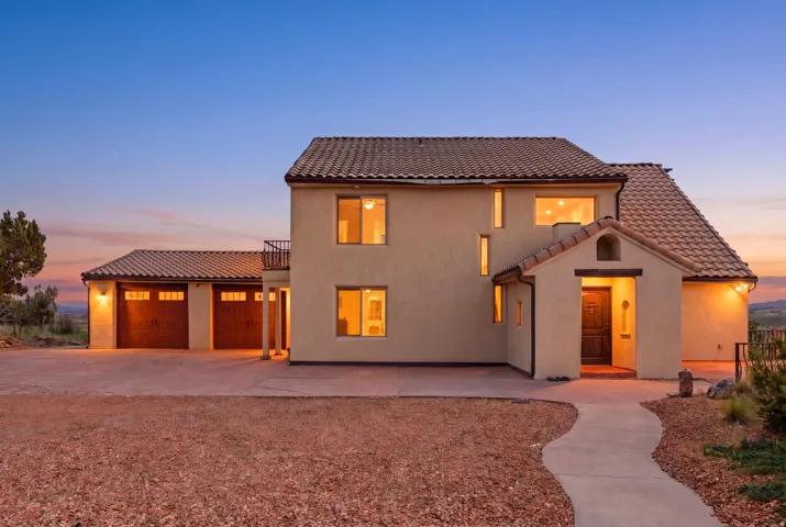 Stucco exterior with a tiled roof