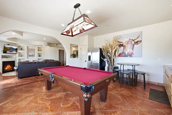 Recreation room featuring a pool table, tiled flooring, and recessed lighting