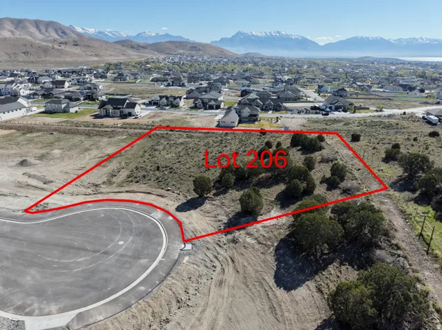 Vacant land parcel featuring natural shrubbery and a partial cul-de-sac frontage