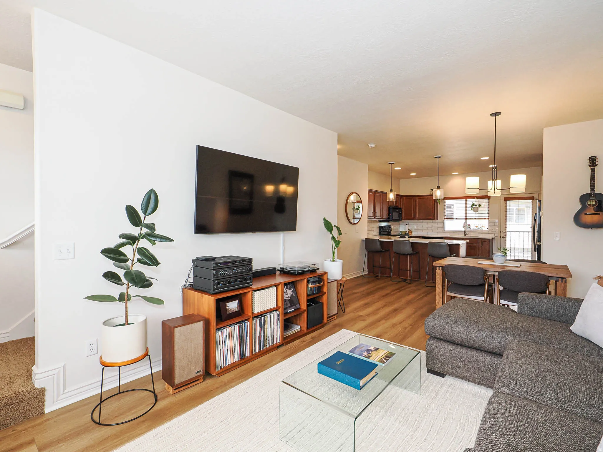 Open-concept living area featuring wood-finish flooring