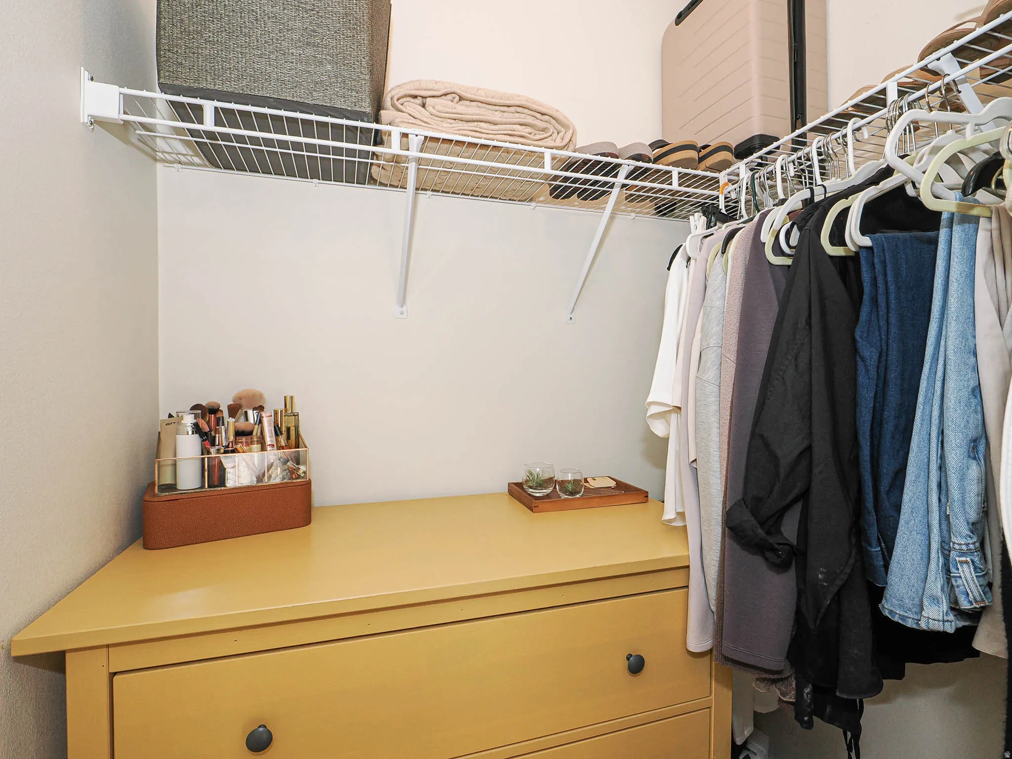 Corner built-in dresser with a light wood-finish countertop