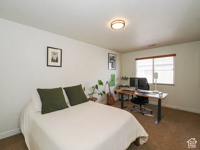 Room featuring neutral wall finishes and carpet flooring