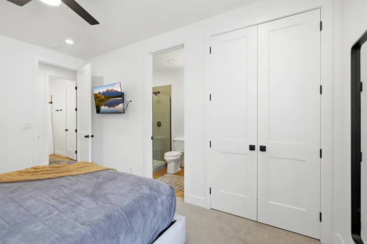White two-panel doors featuring square black hardware