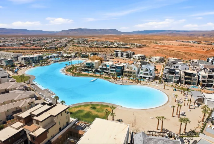 Expansive residential development featuring a large artificial lagoon with sandy beaches
