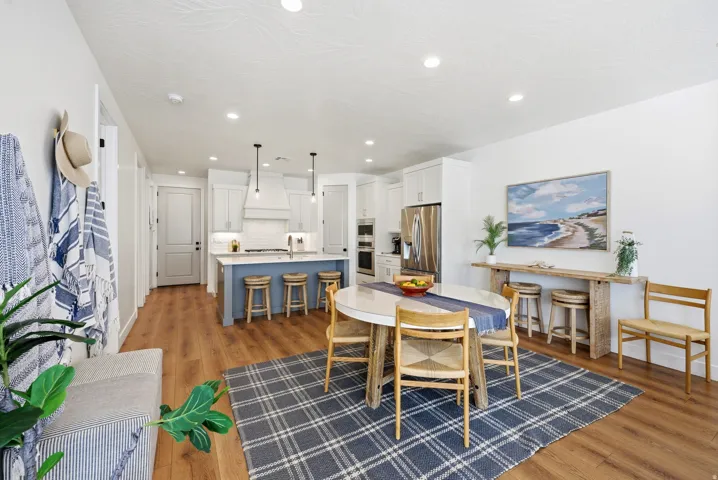 Open-concept living area featuring wood-finish flooring
