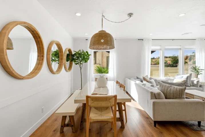 Open-concept living space featuring wood-finish flooring and recessed lighting