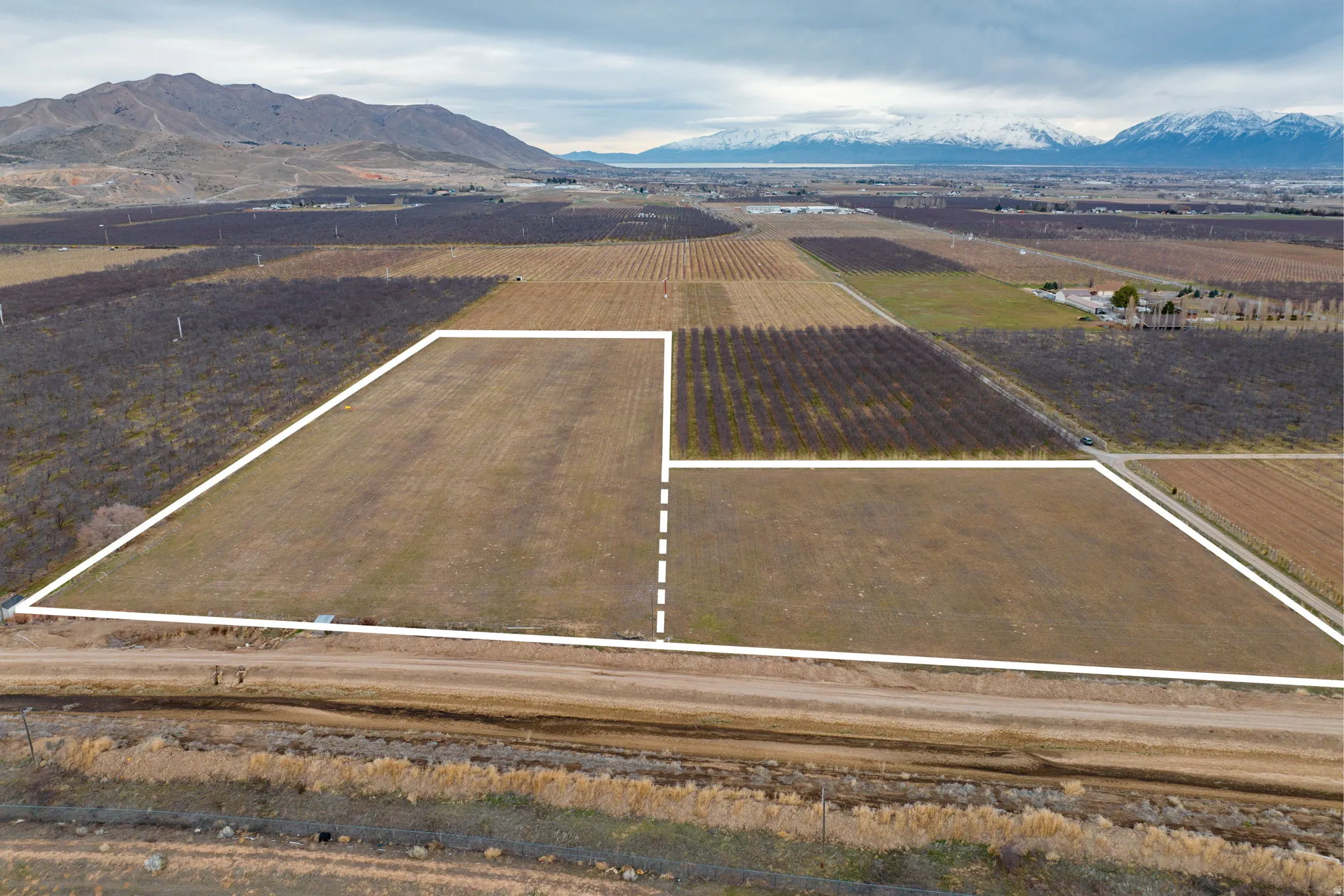 Expansive land parcels outlined in white, featuring clear boundaries and a flat topography