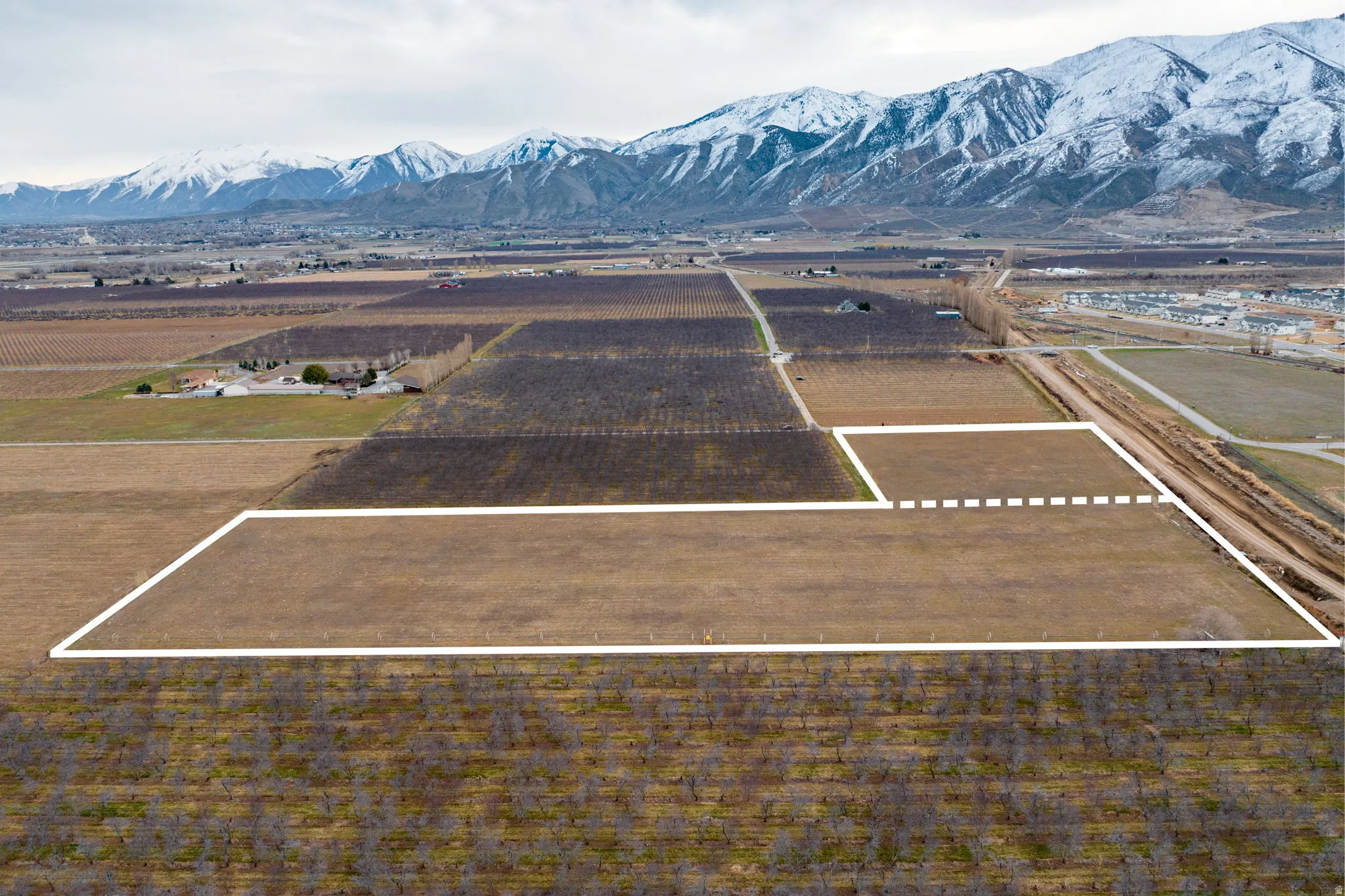 Expansive land parcel with surrounding agricultural fields