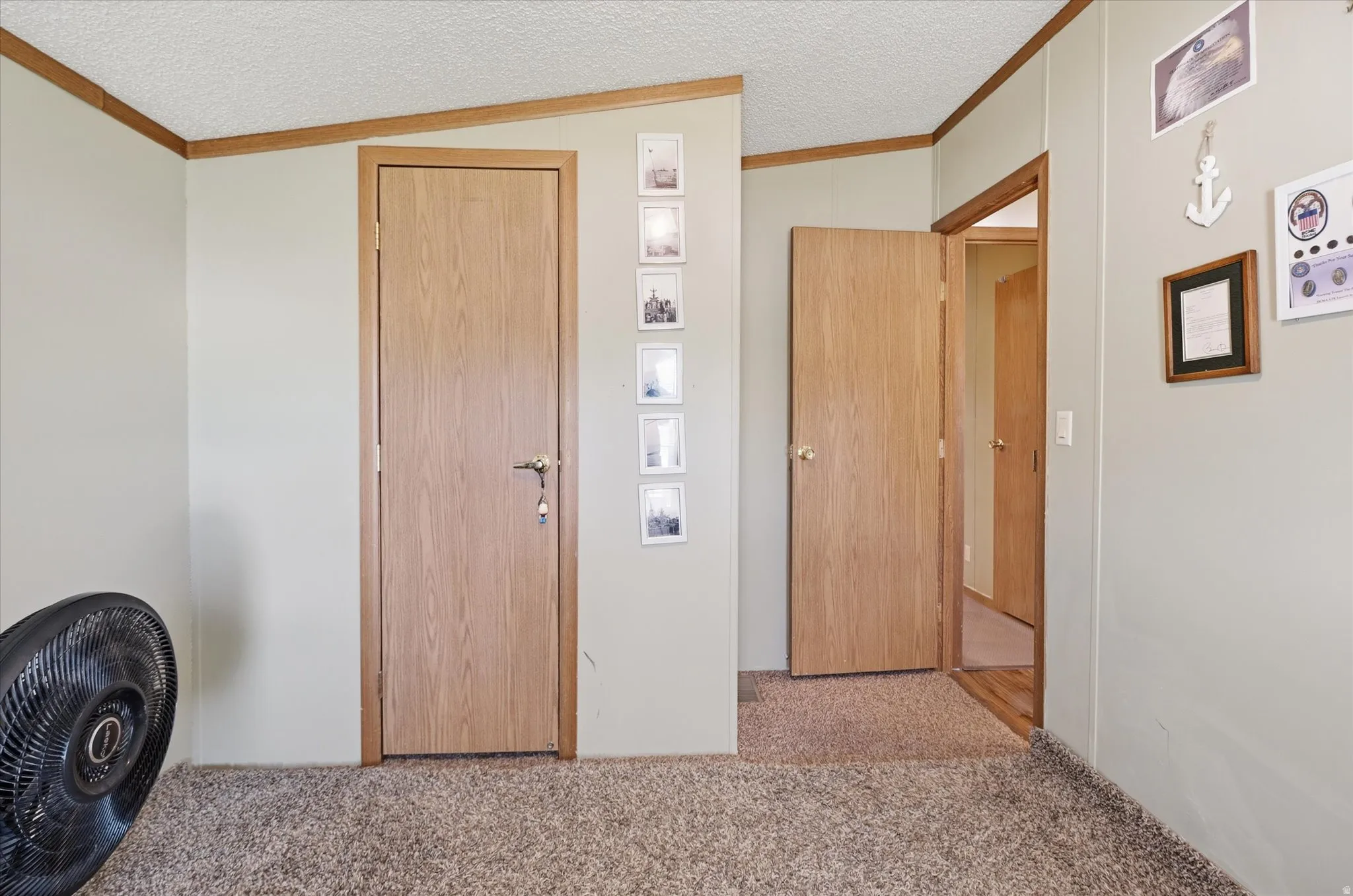Neutral wall tones complemented by light wood-finish trim and doors