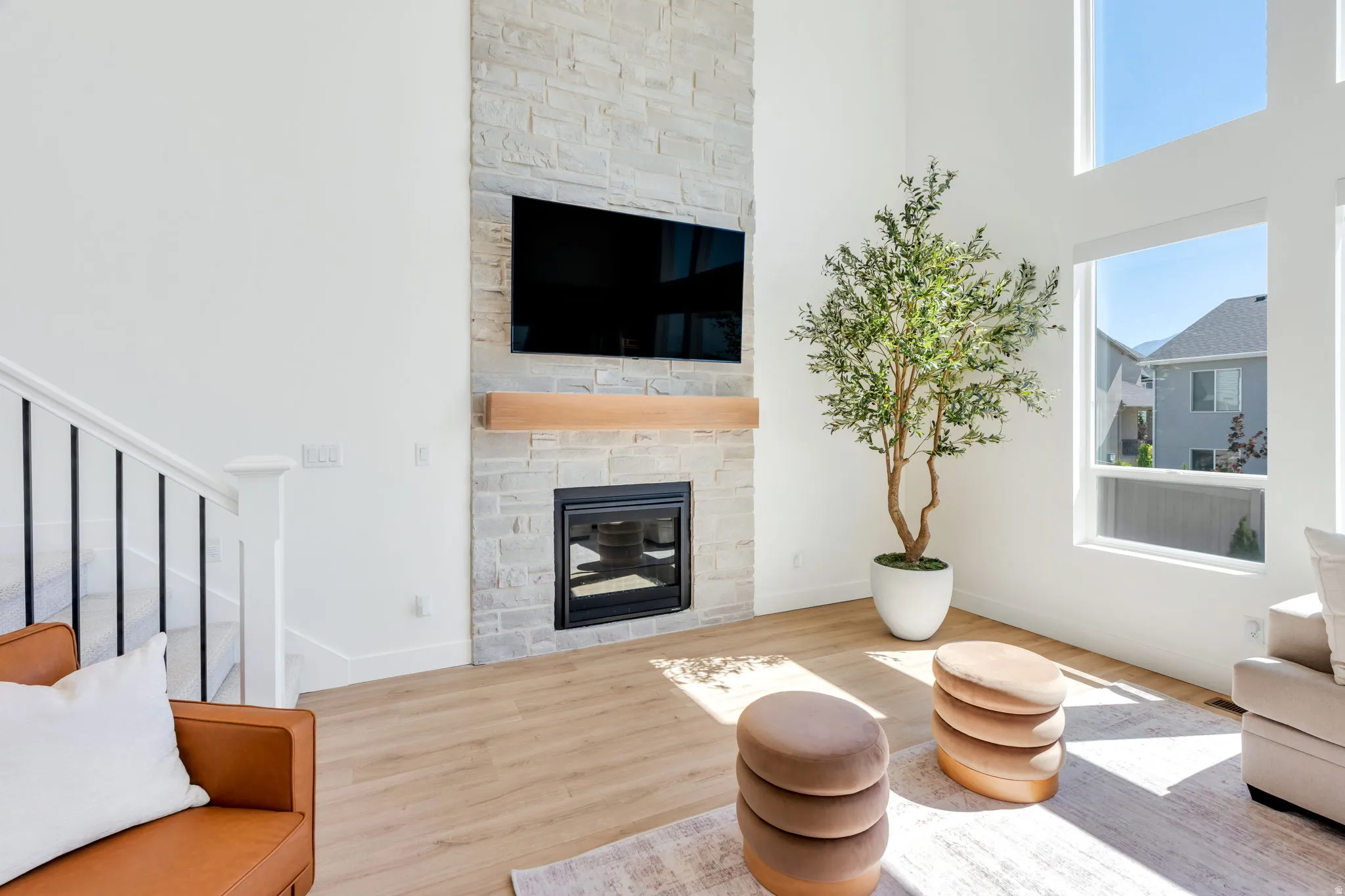 Stone-faced fireplace with a wood mantel