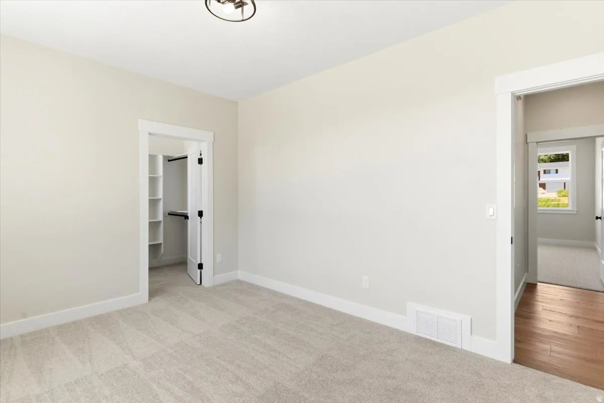 Main Floor 2nd bedroom with walk-in closet