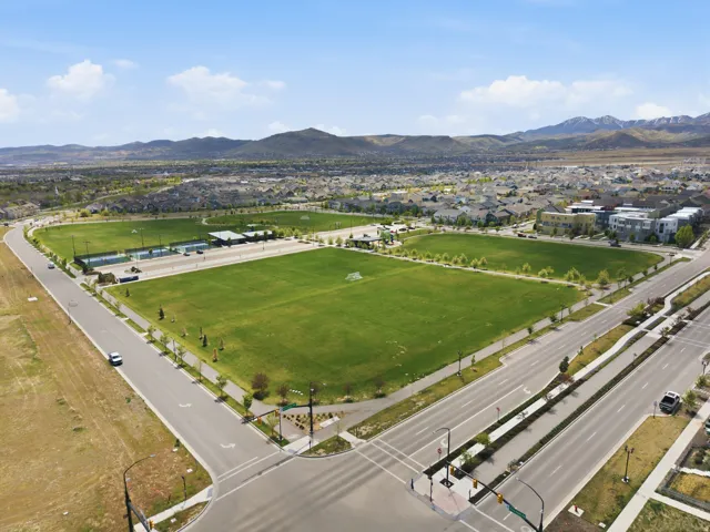 Highland Park located one block from the home, featuring pickleball courts, open green space, sports fields, and walking paths.