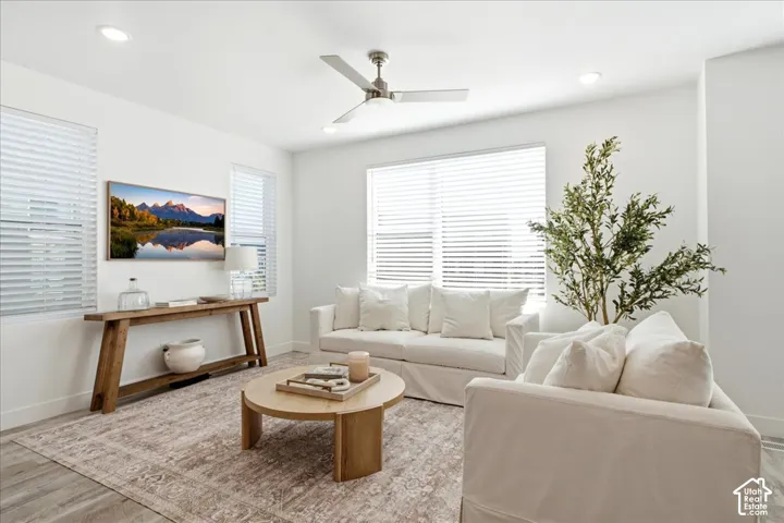 Light-filled great room with expansive windows, open-concept living, and seamless flow throughout the main level.