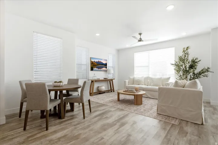 Light-filled great room with expansive windows, open-concept living, and seamless flow throughout the main level.