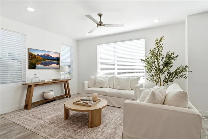 Light-filled great room with expansive windows, open-concept living, and seamless flow throughout the main level.