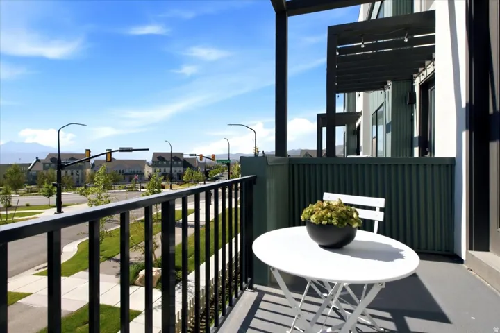 Private balcony providing additional outdoor living space with neighborhood views.
