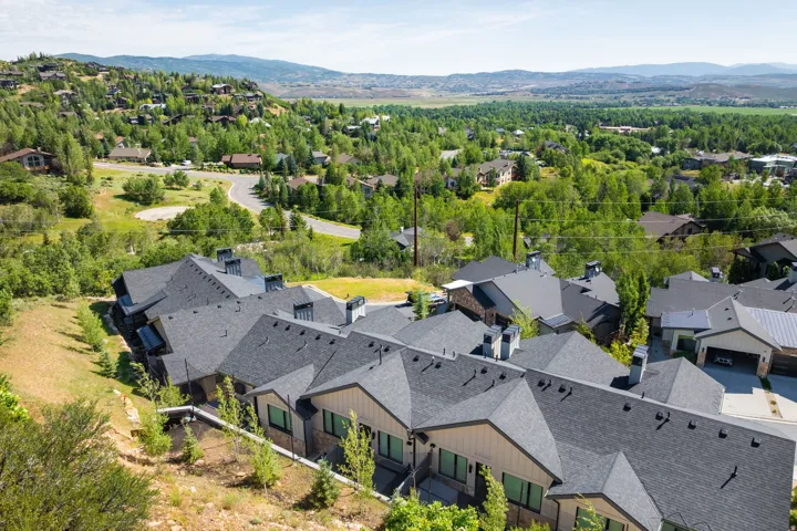 Contemporary residences featuring multi-pitched roofs and exterior siding