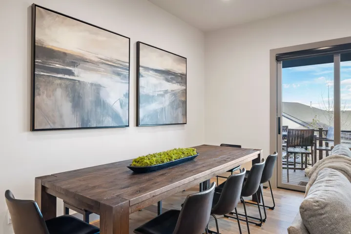 Light wood-finish flooring complements the neutral wall color