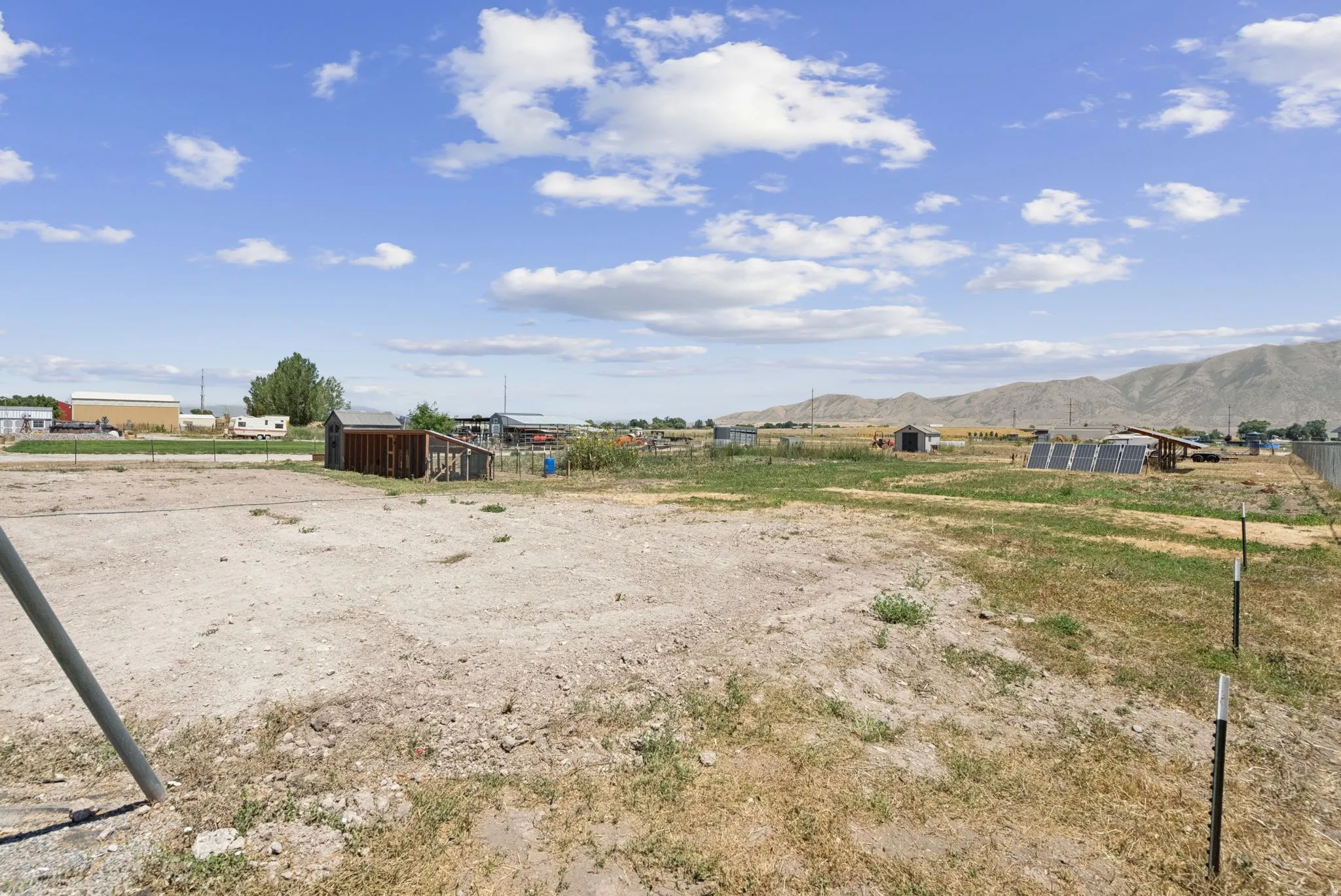 Expansive cleared lot with distant mountain backdrop