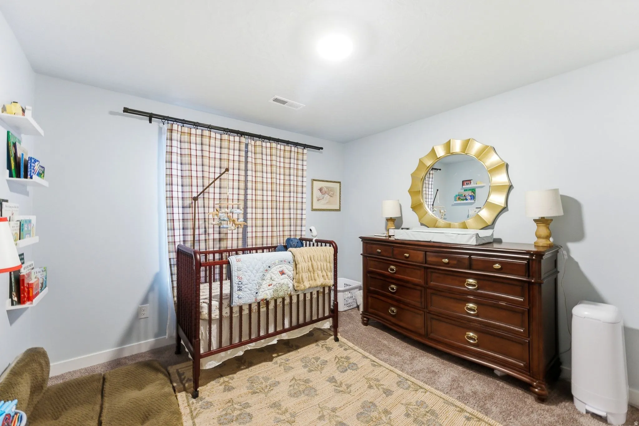 Carpeted room with light blue wall paint and white trim