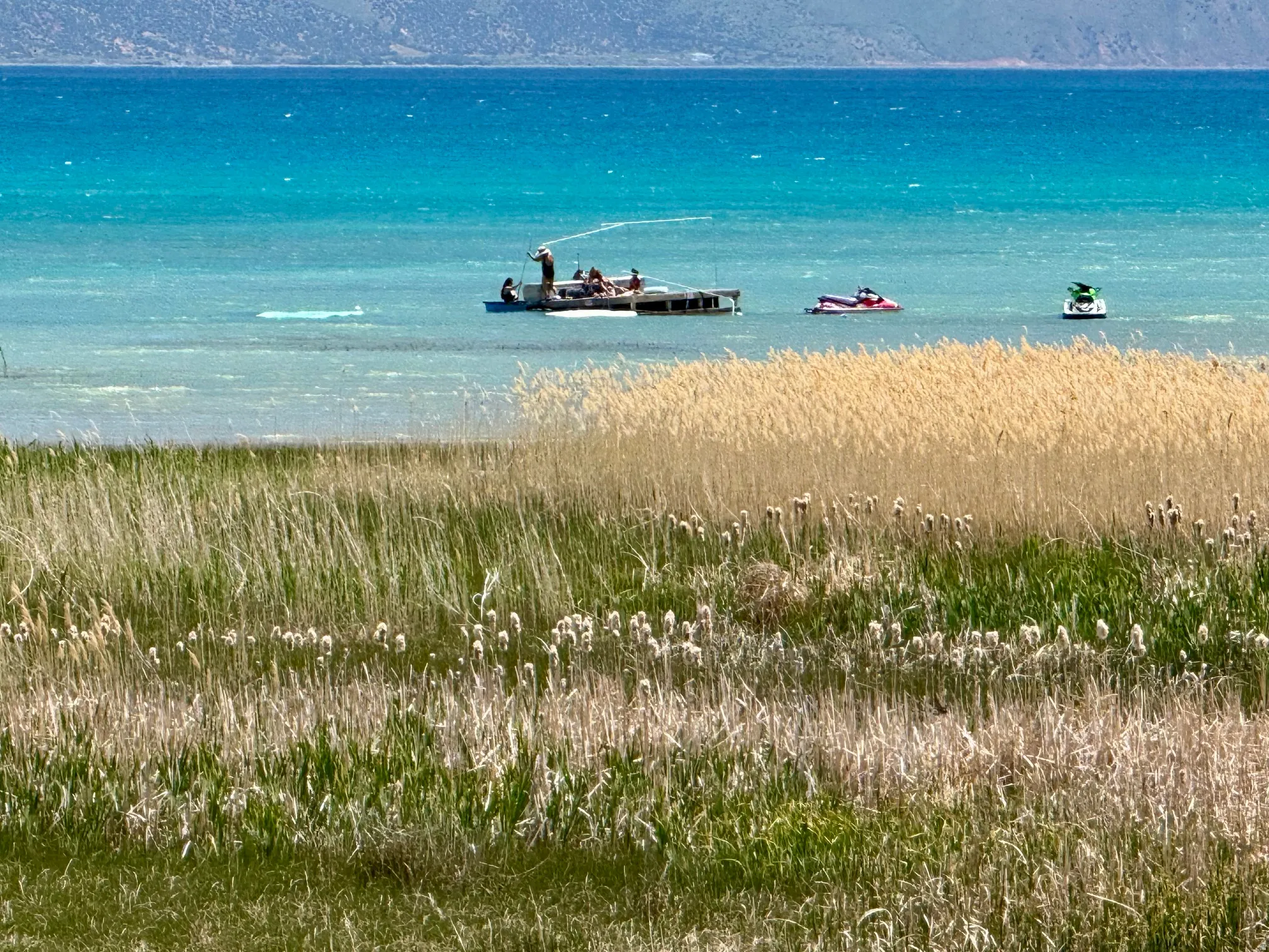 Expansive water body with a mountainous backdrop