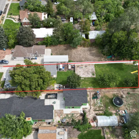 Expansive lot featuring a large grassy area and established trees