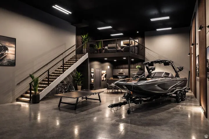 Spacious multi-level interior featuring polished concrete flooring and a dark ceiling